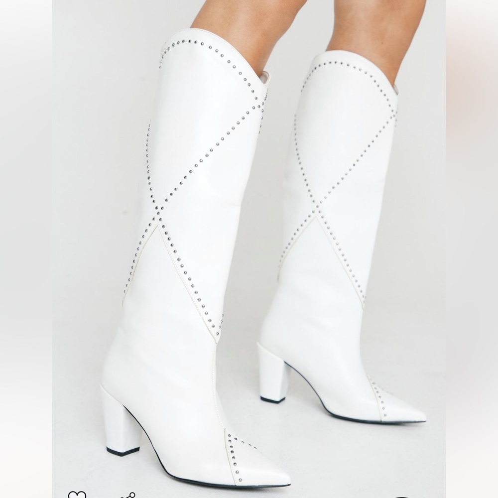 Gently worn white cowboy boots with rhinestone detail.